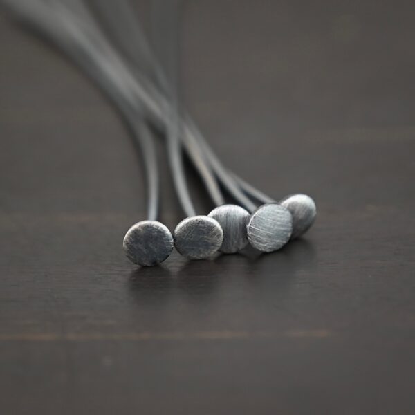 Nail Headpin oxidized 5mm shown on dark background