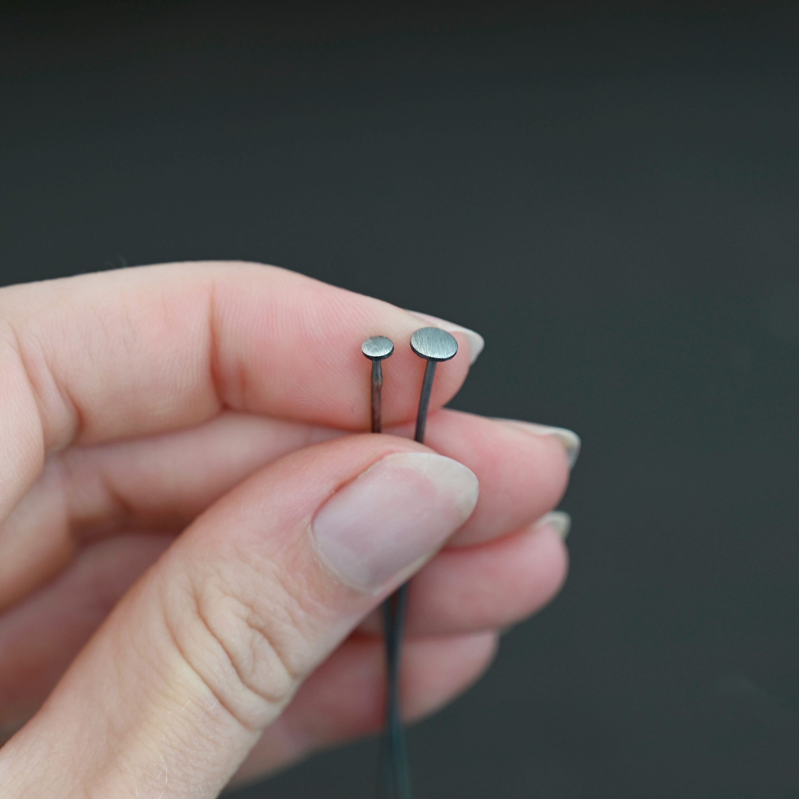 Nail Headpin oxidized shown in hand