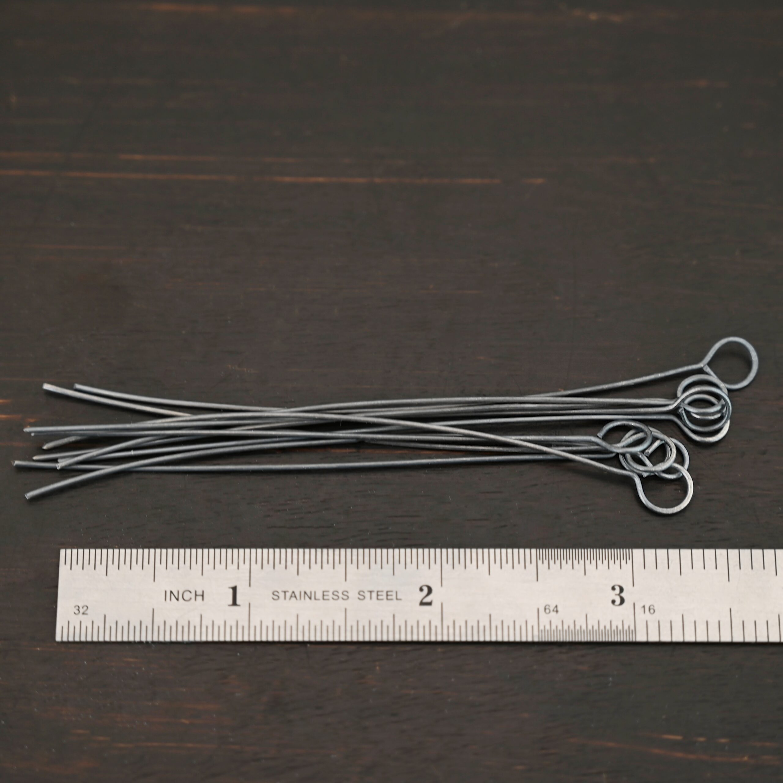 Eyepin oxidized 10pcs shown by ruler