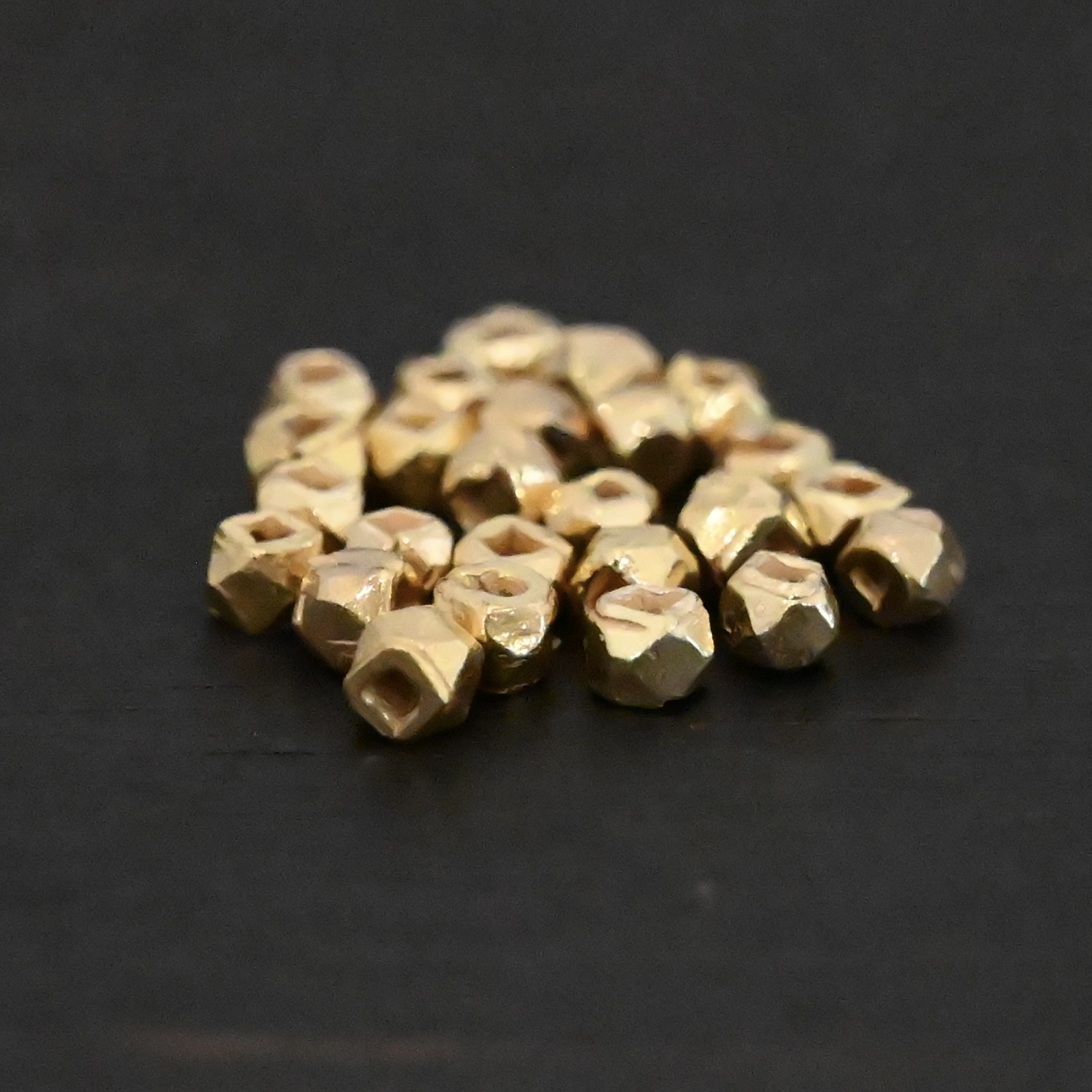 Gold Filled Cubed Beads shown on dark background