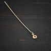Gold Filled swirl headpin shown on dark background
