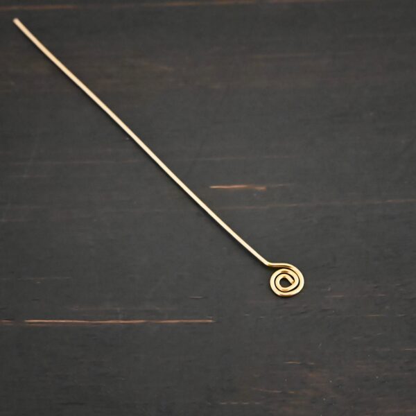 Gold Filled Swirl headpin shown on dark background