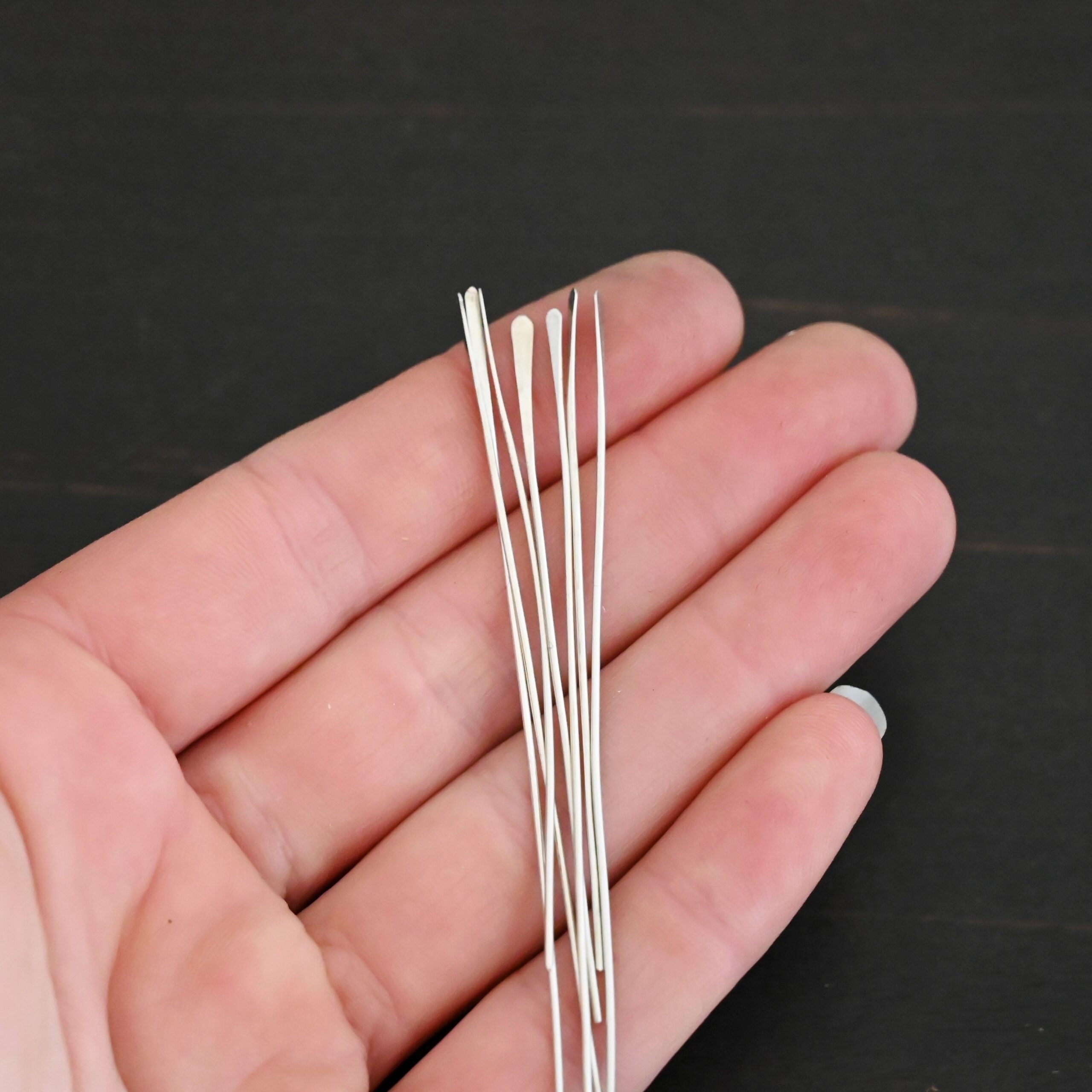 Silver Shiny Paddle headpin shown in hand