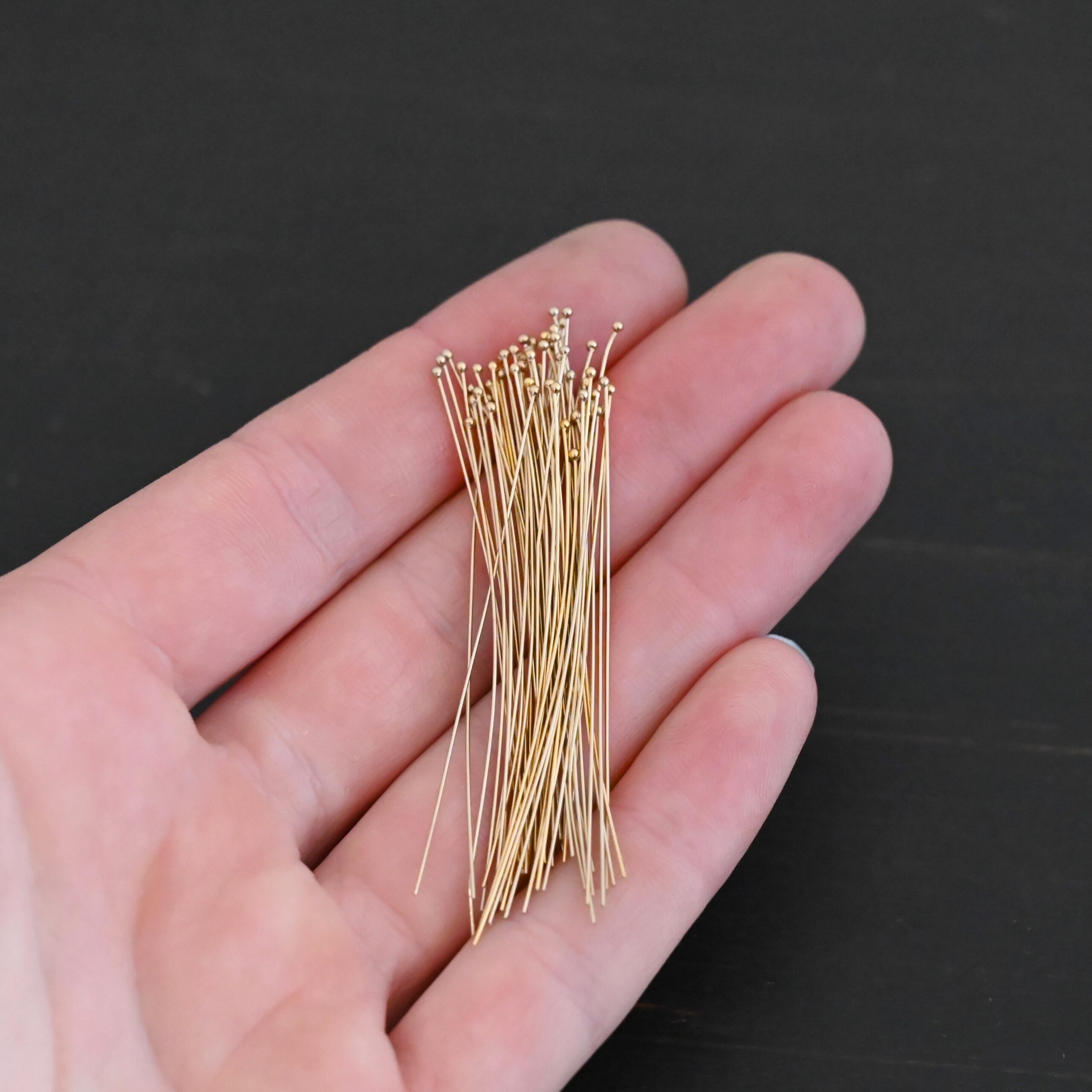 Gold Filled Ball Headpins shown in hand