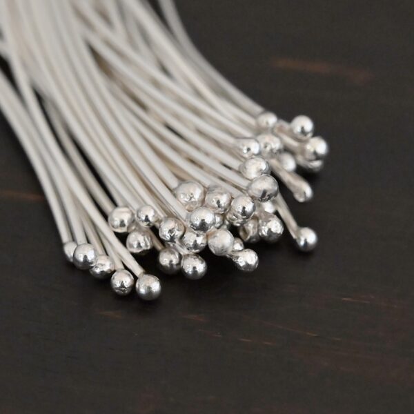 Large Shiny Ball Headpins shown on dark background