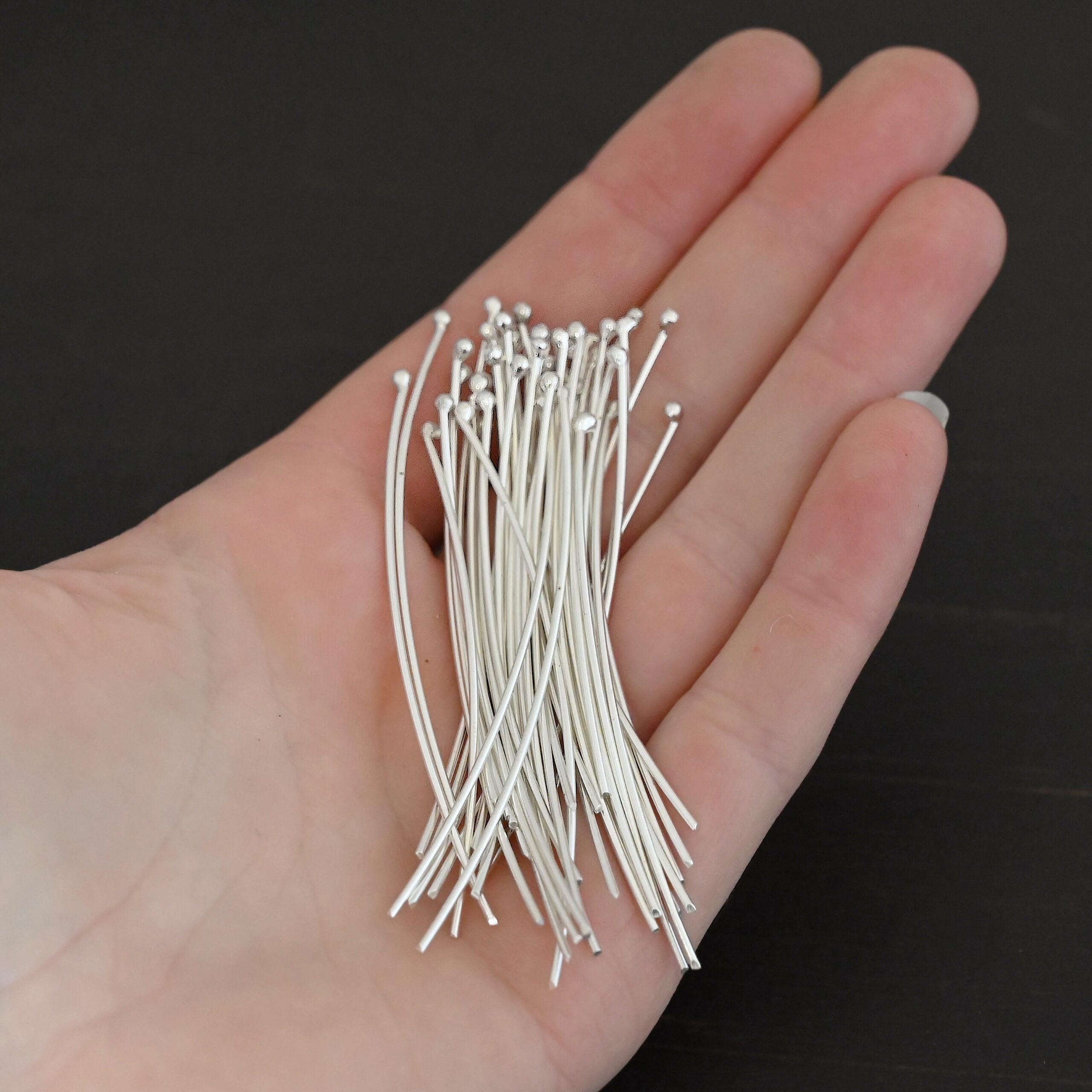 Large Shiny Ball Headpins shown in hand