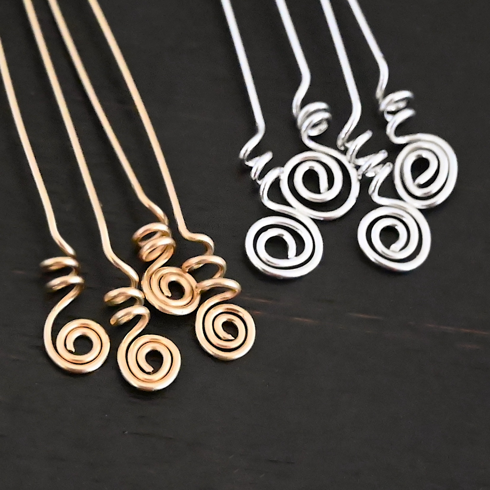 Gold Filled & Silver Shiny Swirl Headpins shown on dark background