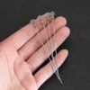 Silver Oxidized Swirl Headpins shown in hand
