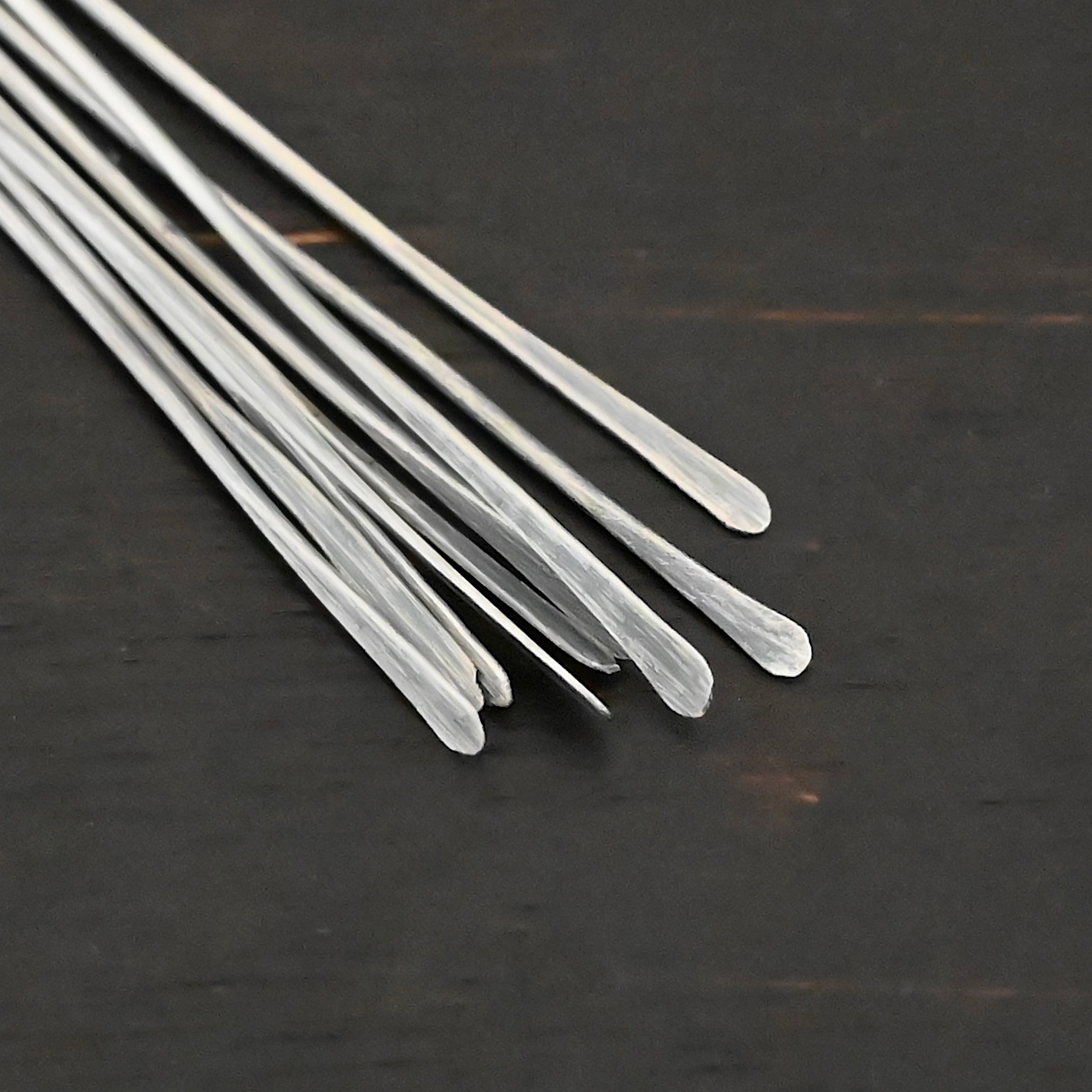 Silver Oxidized Paddle Headpins shown on dark background