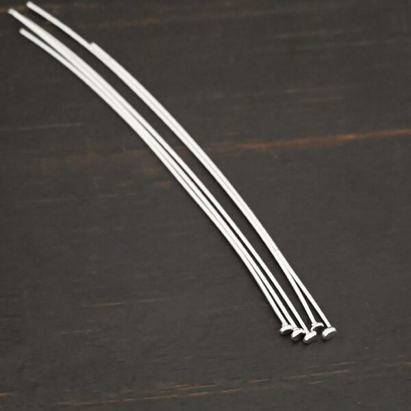 Silver Shiny Large Hole Headpin shown on dark background