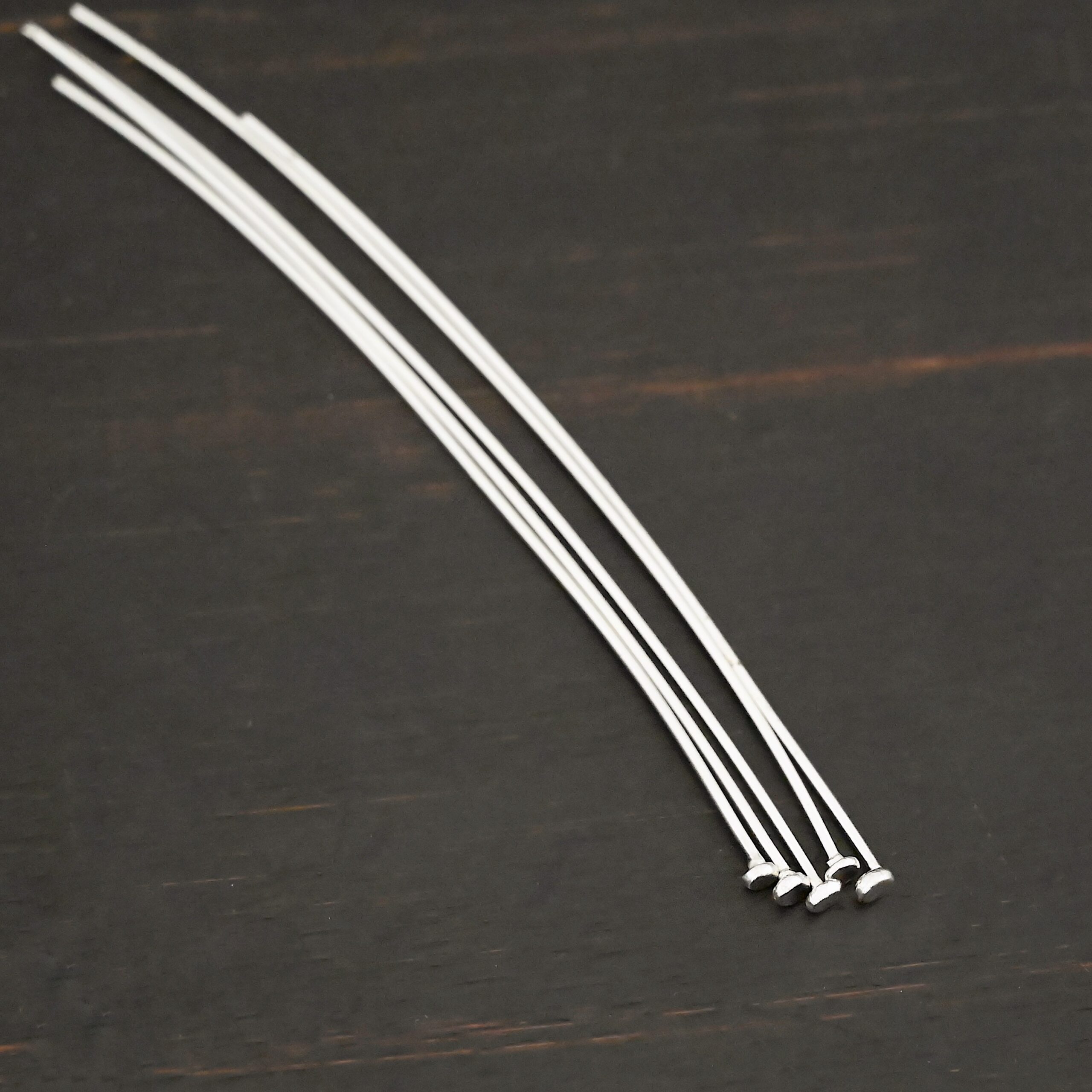 Large Hole Headpin Silver Shiny Large Hole Headpin shown on dark background