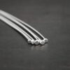 Silver Shiny Large Hole Headpin shown on dark background