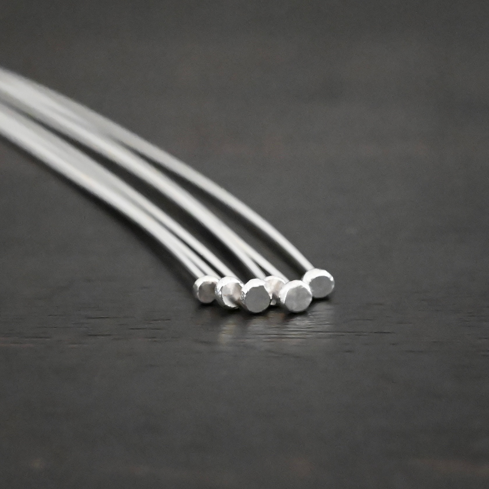 Large Hole Headpin Silver Shiny Large Hole Headpin shown on dark background