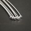 Silver Shiny Large Hole Headpin shown on dark background