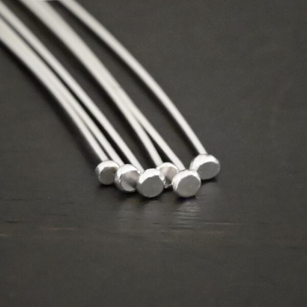 Silver Shiny Large Hole Headpin shown on dark background