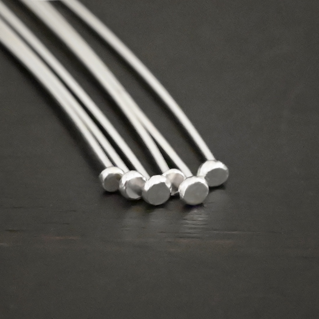 Large Hole Headpin Silver Shiny Large Hole Headpin shown on dark background