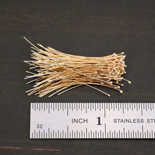 14k gold 30 gauge ball headpins shown by ruler