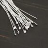 Silver Shiny Round Dot headpins shown on dark background