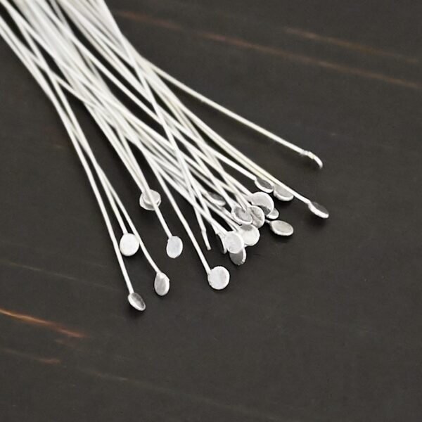 Silver Shiny Round Dot headpins shown on dark background