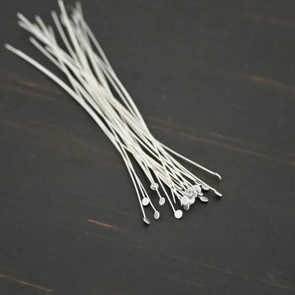 Silver Shiny Round Dot headpins shown on dark background