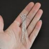 Silver Shiny Round Dot headpins shown in hand