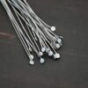 Silver Oxidized Round Dot headpins shown on dark background