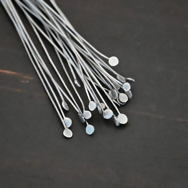 Silver Oxidized Round Dot headpins shown on dark background