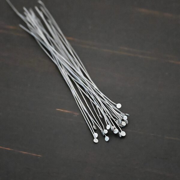 Silver Oxidized Round Dot headpins shown on dark background