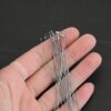 Silver Oxidized Round Dot headpins shown in hand