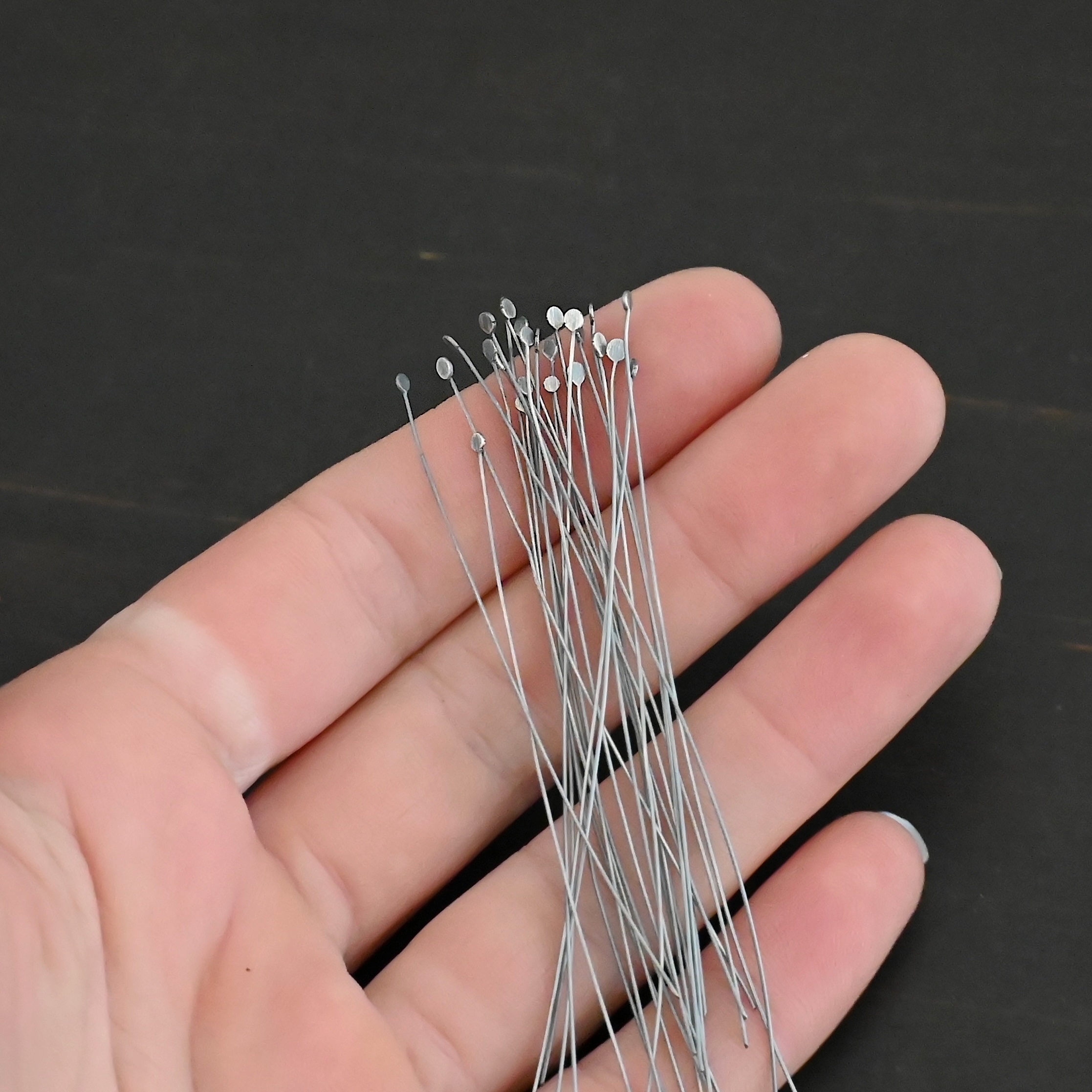 Round Dot Headpin Ox Silver Oxidized Round Dot headpins shown in hand