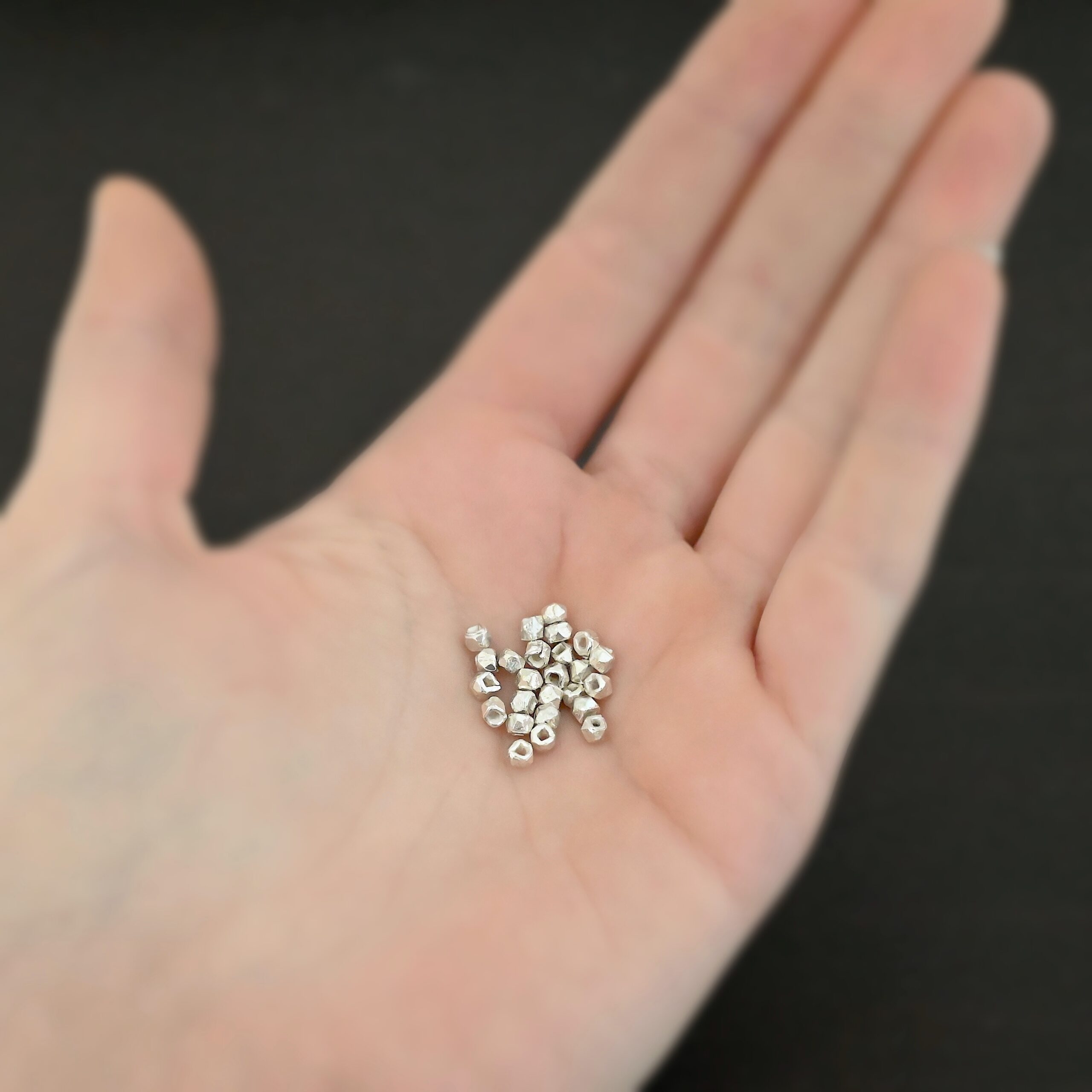 Cubed Bead shiny Silver Shiny cubed Beads shown in hand