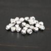 Silver Shiny cubed Beads shown on dark background