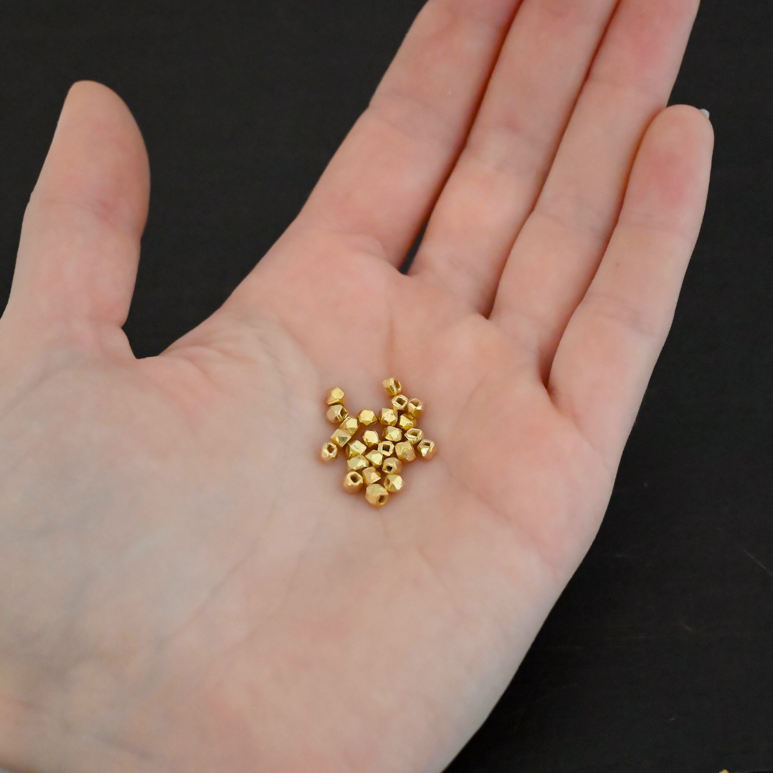 Gold Filled cubed Beads shown in hand
