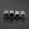 Handmade silver oxidized end caps on dark background