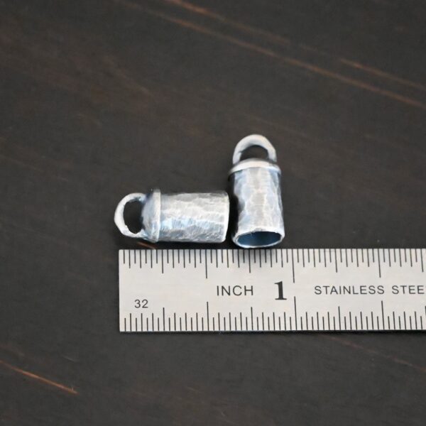 Handmade silver 6mm oxidized end caps shown by ruler
