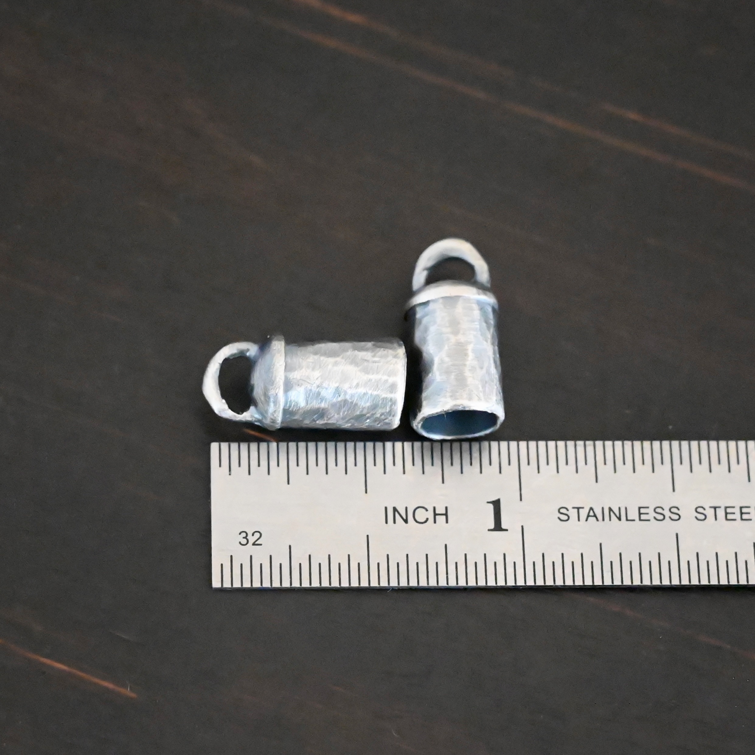 Handmade 6mm End Caps Handmade silver 6mm oxidized end caps shown by ruler