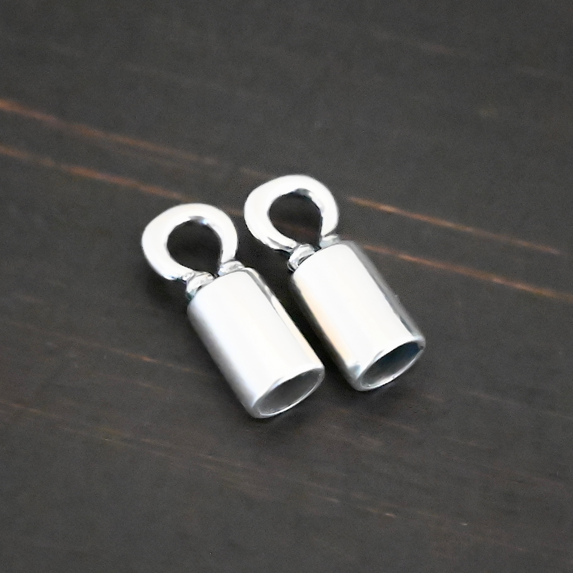 End Caps shiny Silver shiny end caps shown on dark background