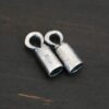Silver oxidized end caps shown on dark background