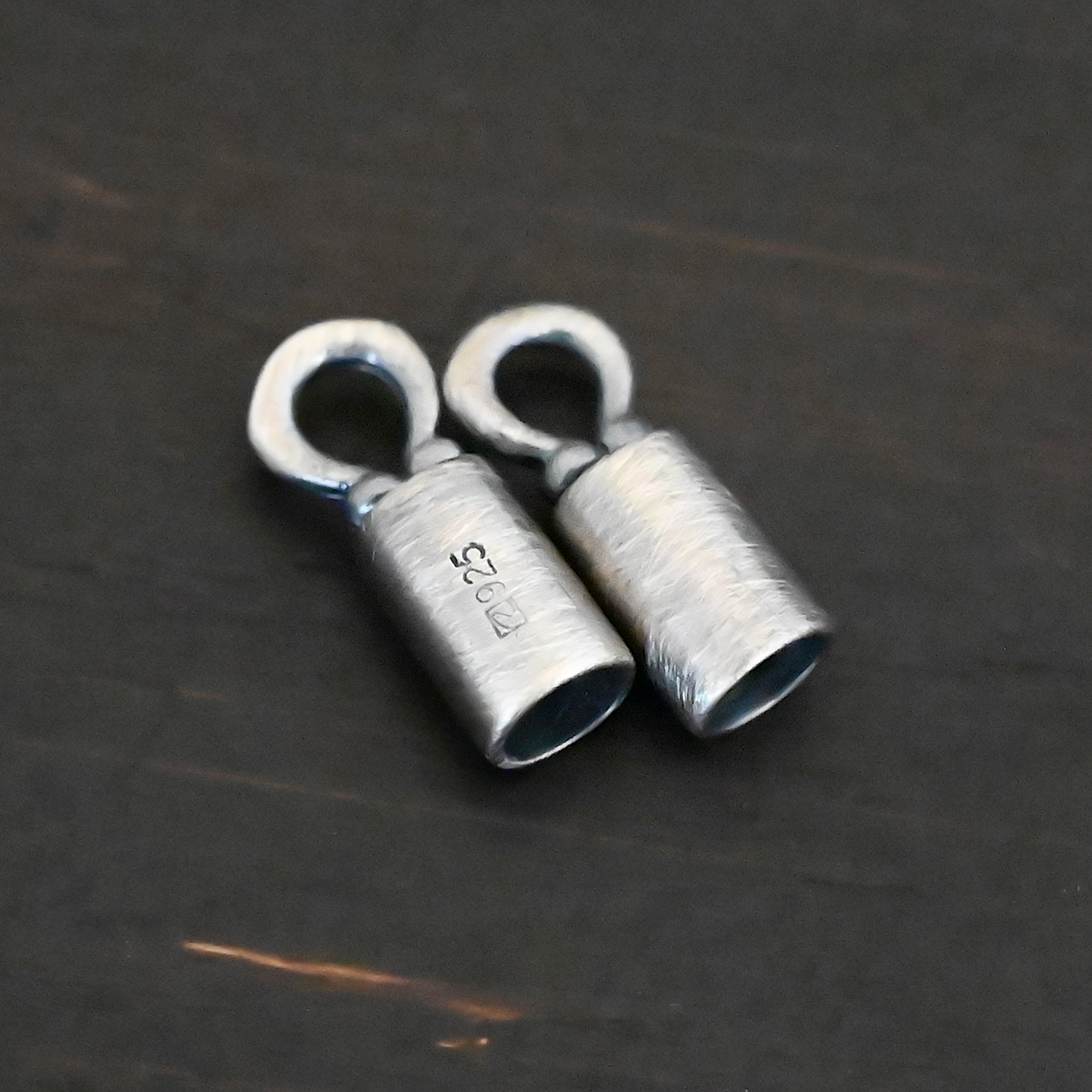 End Caps ox Silver oxidized end caps shown on dark background