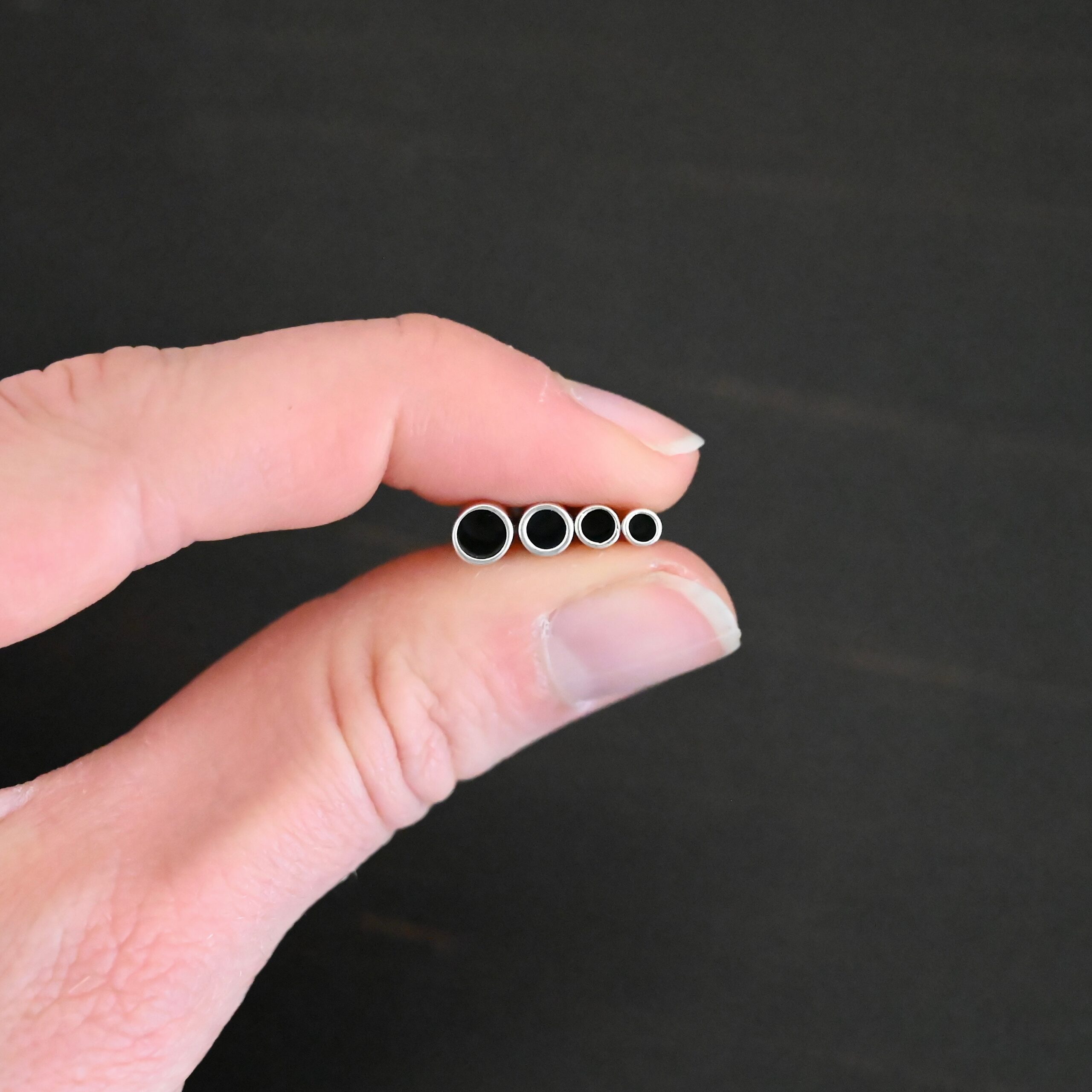 End Caps ox Silver oxidized end caps shown in hand