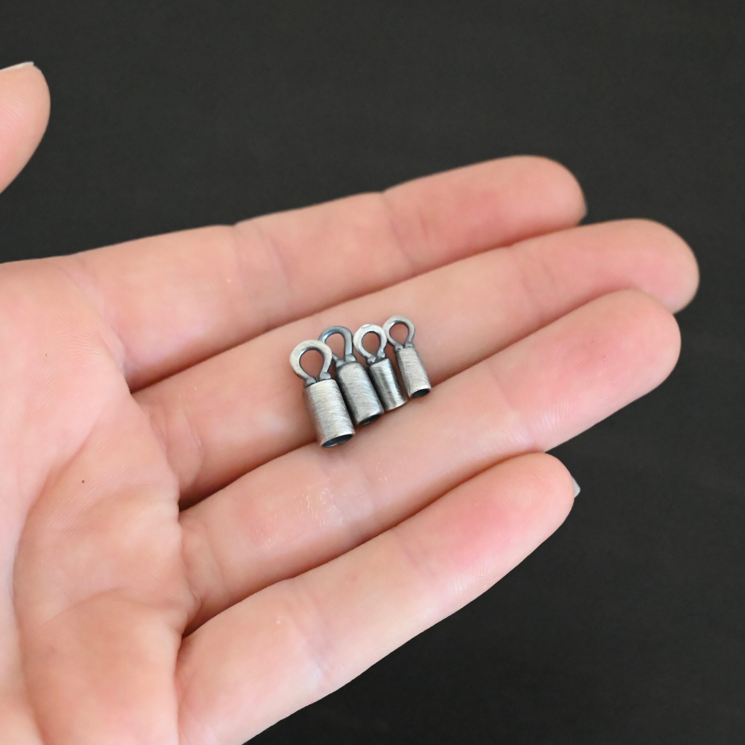 End Caps ox Silver oxidized end caps shown in hand