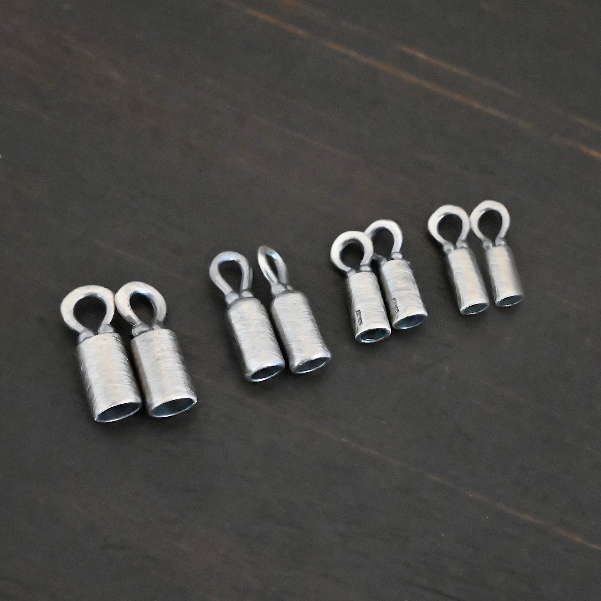 End Caps ox Silver oxidized end caps shown on dark background