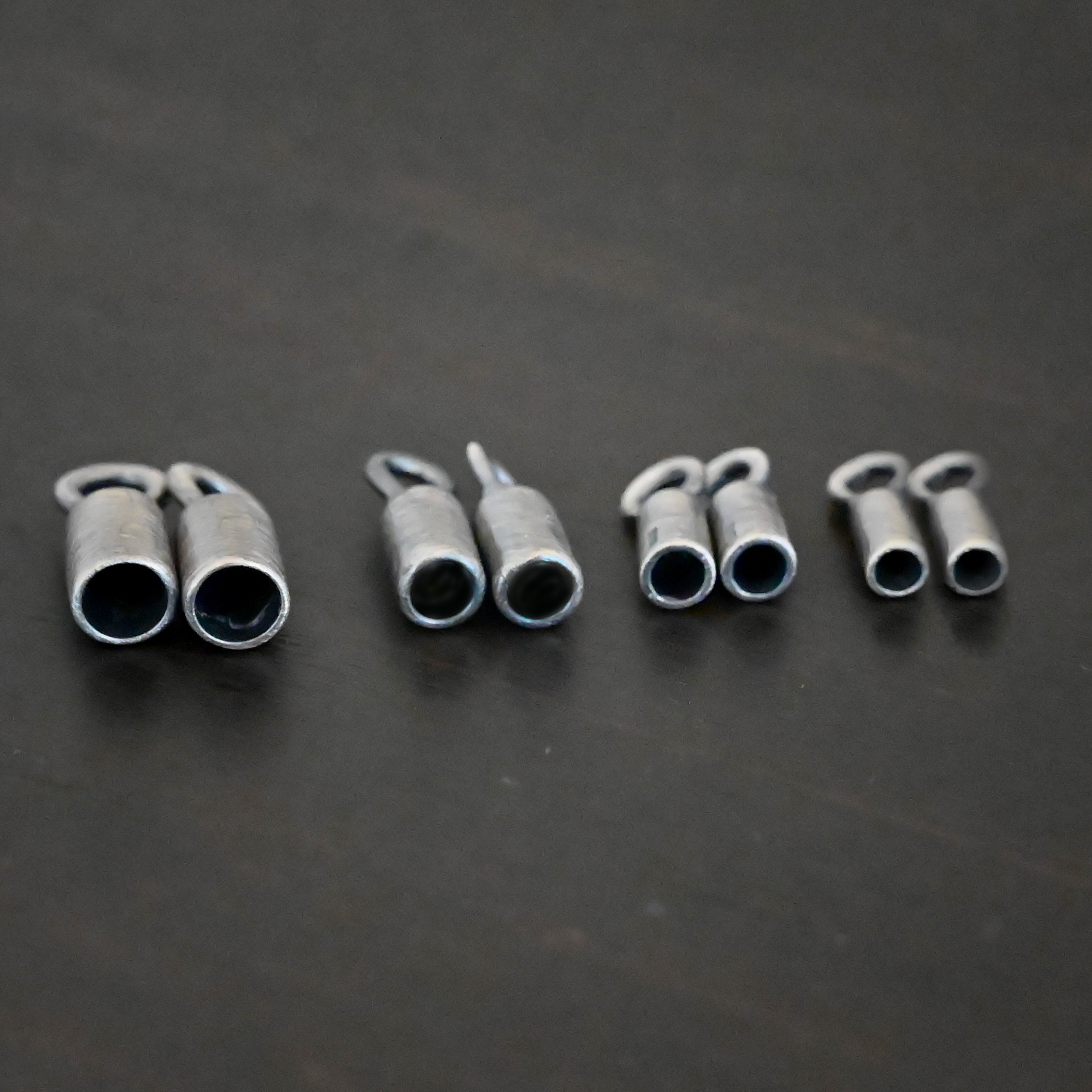 End Caps ox Silver oxidized end caps shown on dark background