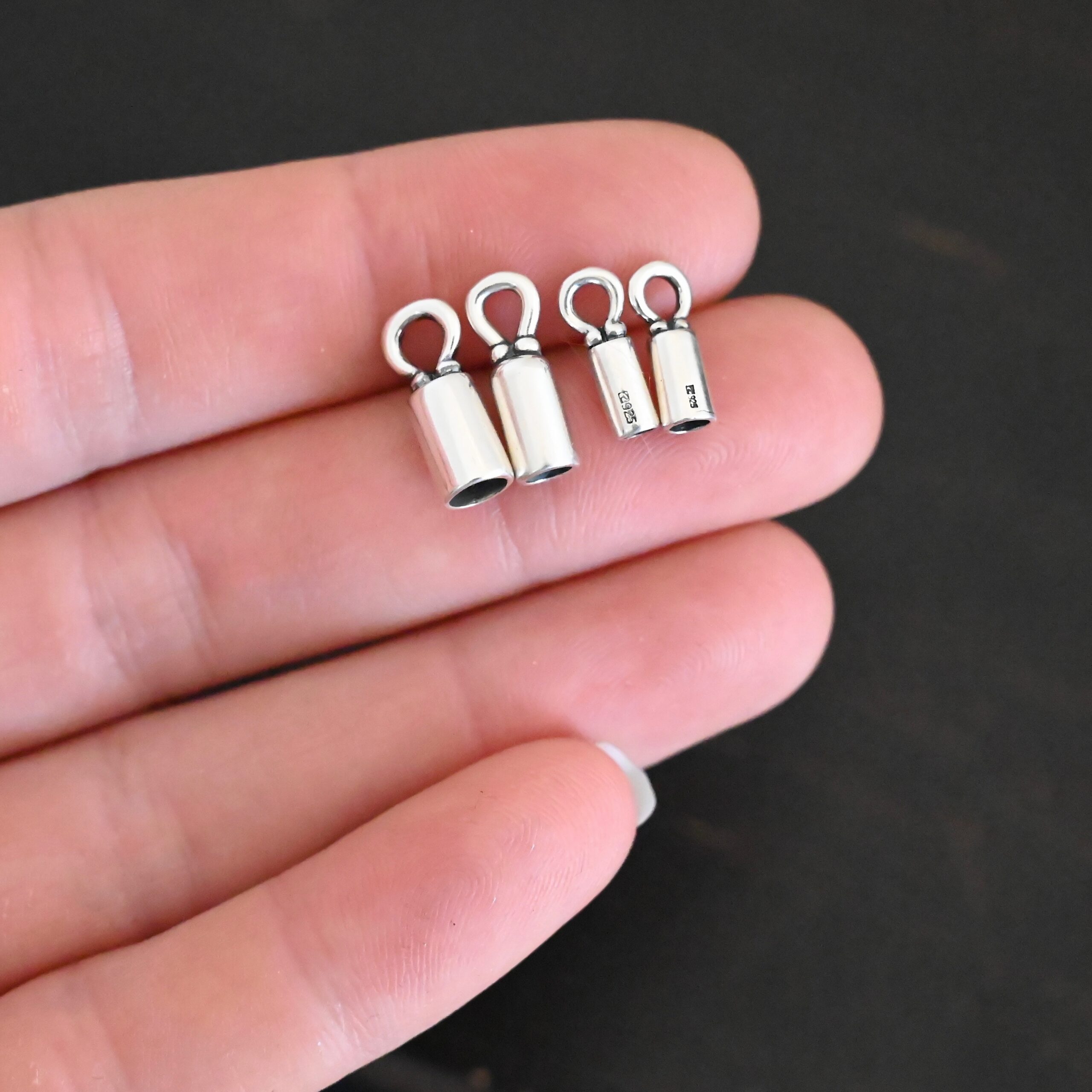 End Caps shiny Silver 2mm shiny end caps shown in hand