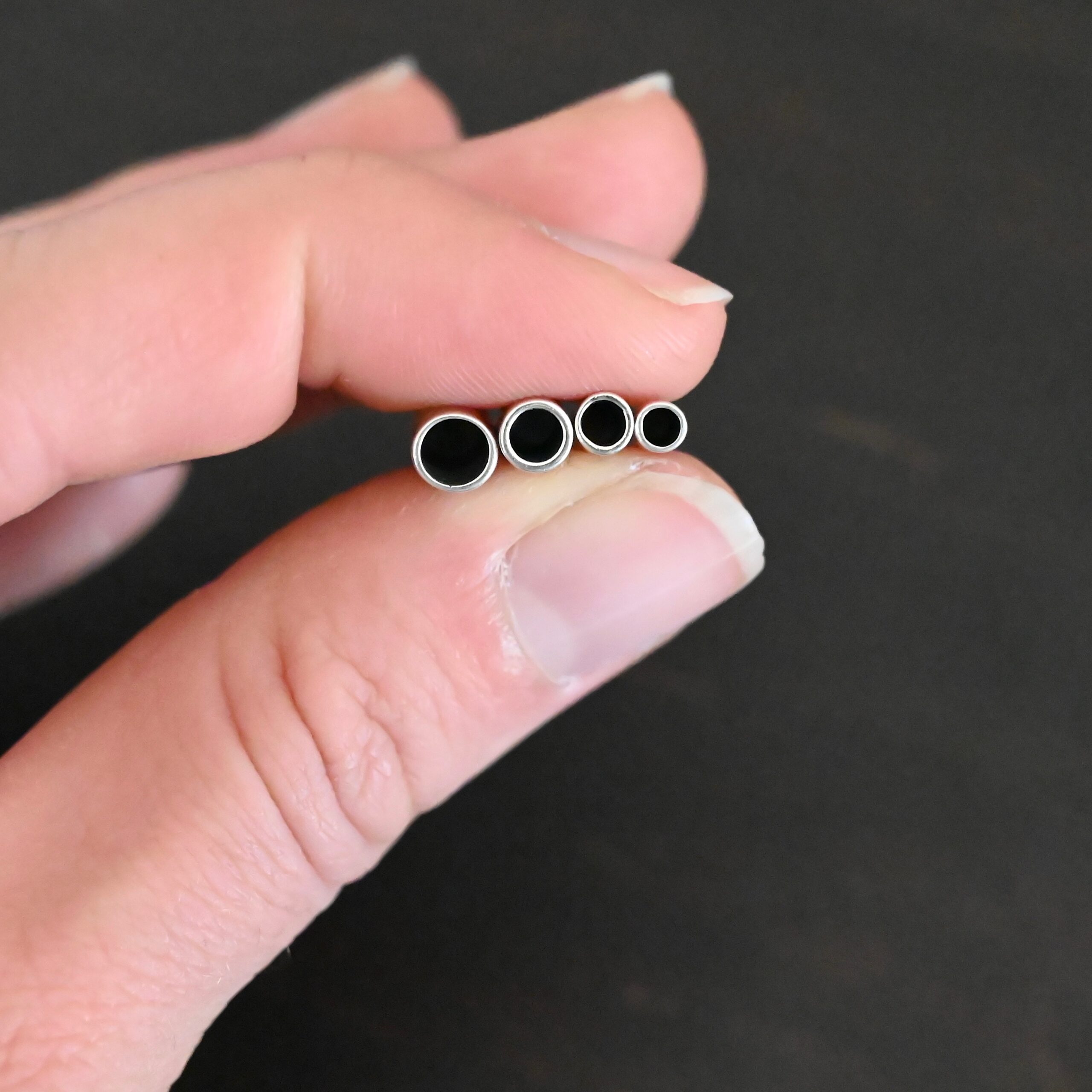 End Caps shiny Silver shiny end caps shown in hand