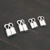 Silver shiny end caps shown on dark background