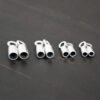 Silver shiny end caps shown on dark background