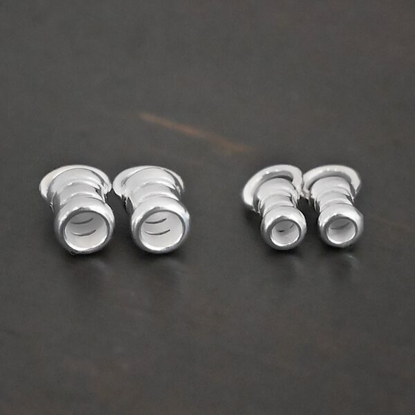 Silver shiny 2mm & 3mm crimps shown on dark background
