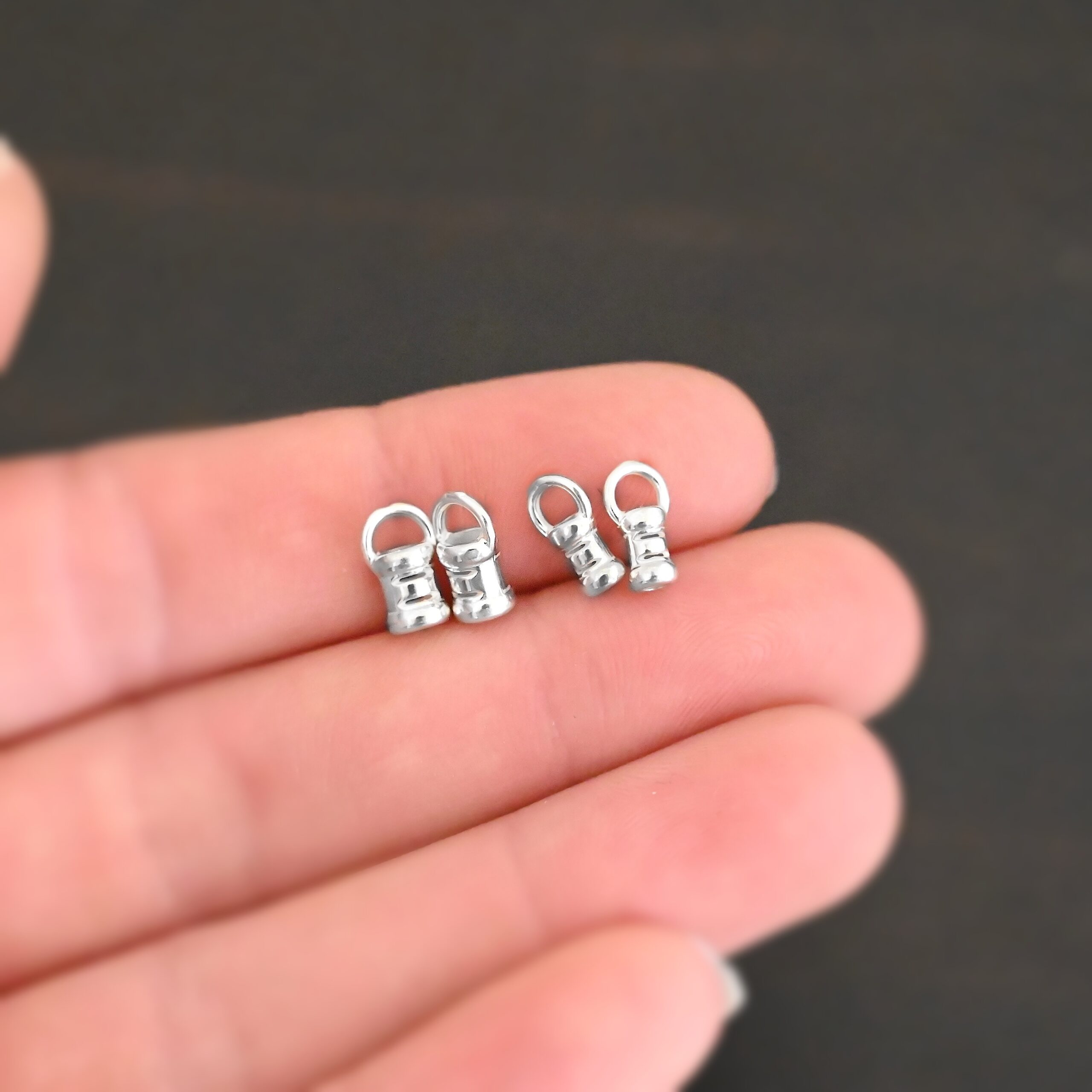 Silver shiny 2mm & 3mm crimps shown in hand