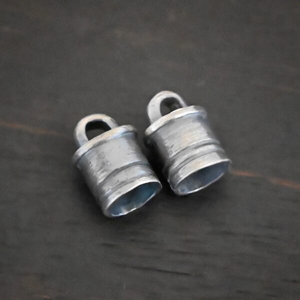 Silver Oxidized 6x9mm end caps shown on dark background